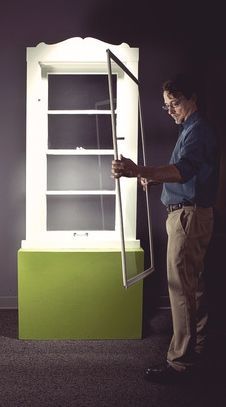 Indow CEO installing first window insert with compression seal