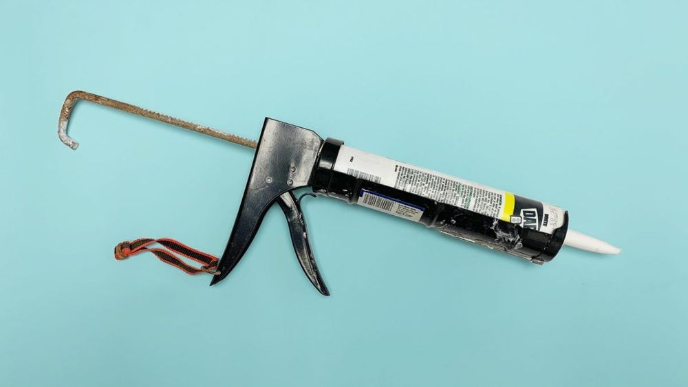 caulk gun used to caulk and insulate windows