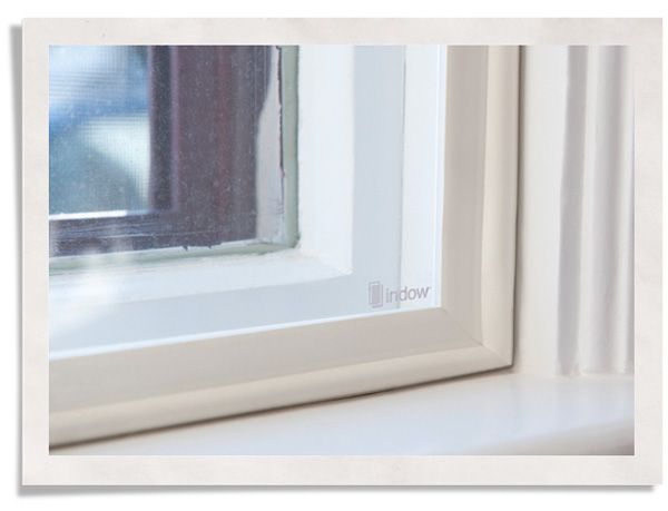 closeup of storm window insert sealing windows for winter