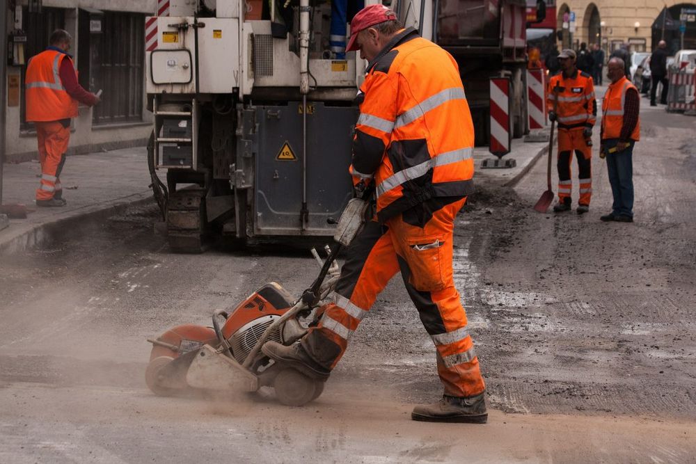 Construction worker doing road construction