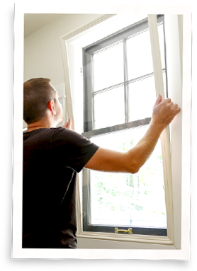 man installing interior window insert.