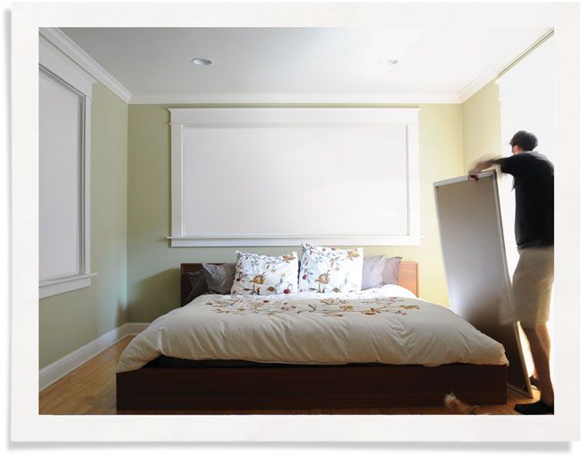 Man installing Indow Sleep Panel in bedroom: It allows you to blackout your windows without curtains