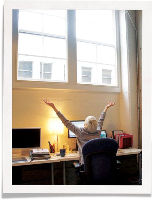 Happy employee: soundproofing commercial spaces windows’ with Indow window inserts is a solution.