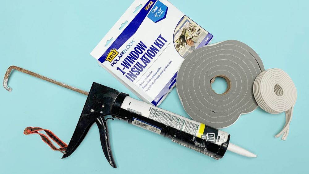 shrink-wrap kit, caulk gun, and weatherstipping all used to winterize windows