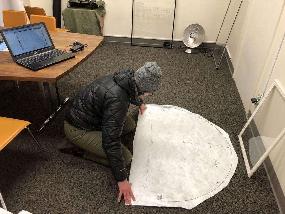 woman drawing odd shaped windows