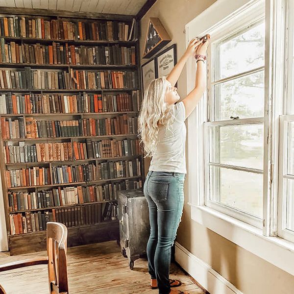 woman using diy measurement system old farmhouse windows for self install diy window inserts