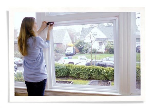 Woman Measuring Window for Indow Window Inserts