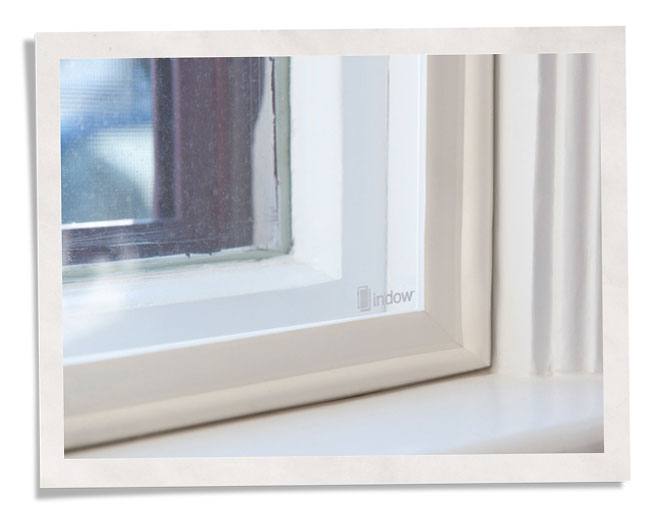 Indow insert installed in a hotel window frame for noise reduction.