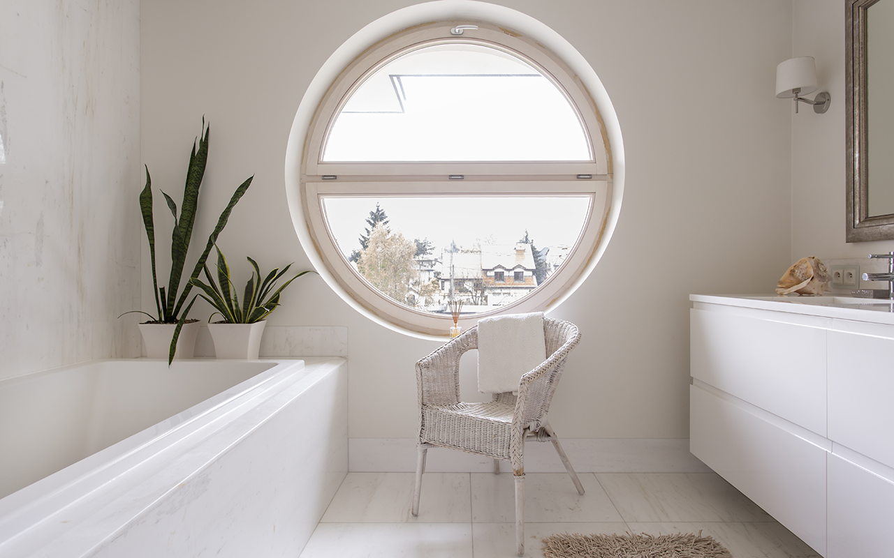 Round circle window overlooking bathroom